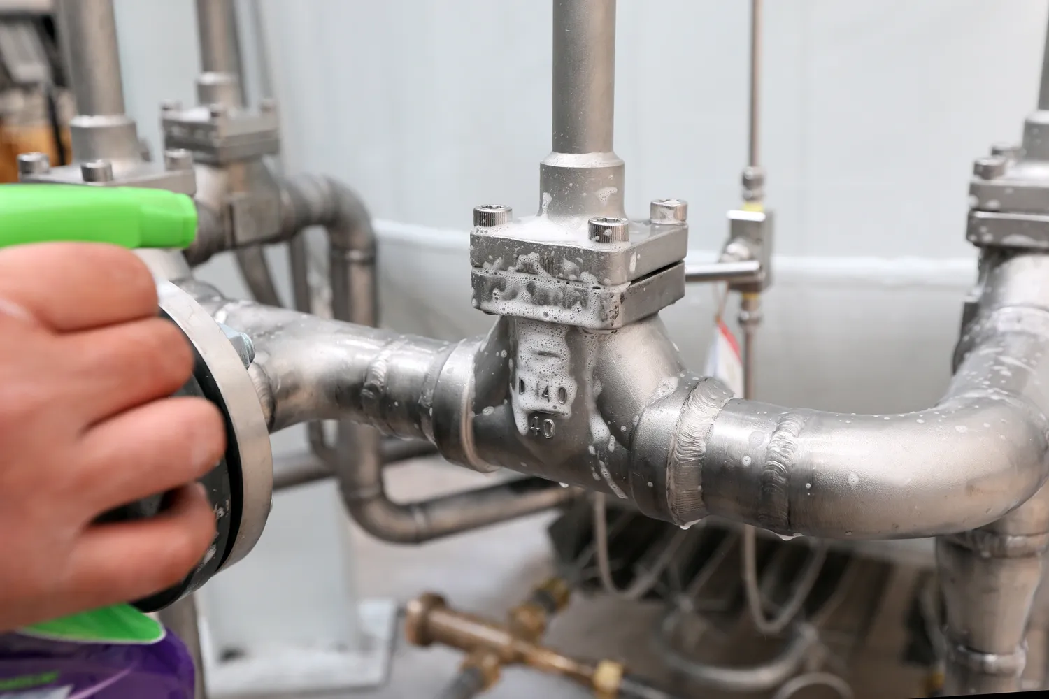 Licensed plumber performing on-site plumbing work