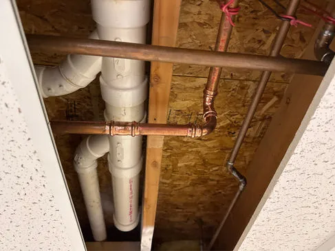 Skilled plumber handling gas system safety checks